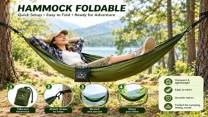 Hammock foldable set up between two trees at a scenic lakeside campsite