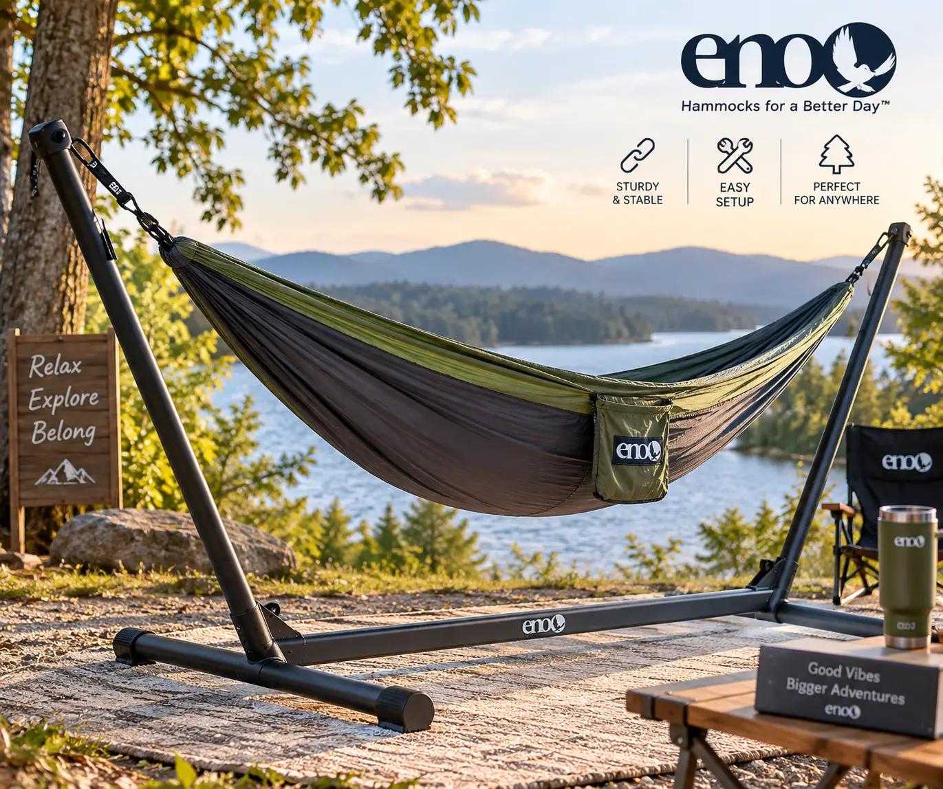 ENO stand supporting a hammock beside a scenic lake with mountains and trees at sunset